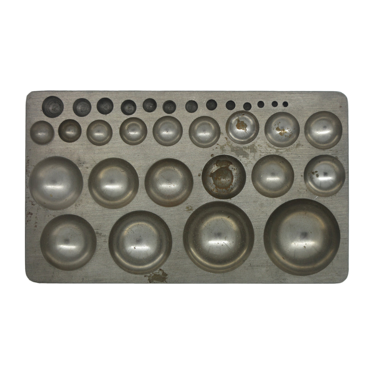 Metal dapping block with graduated round depressions for jewelry making