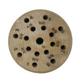 Solid wood saw blade holder organizer with round base designed to store and sort fine saw blades by size