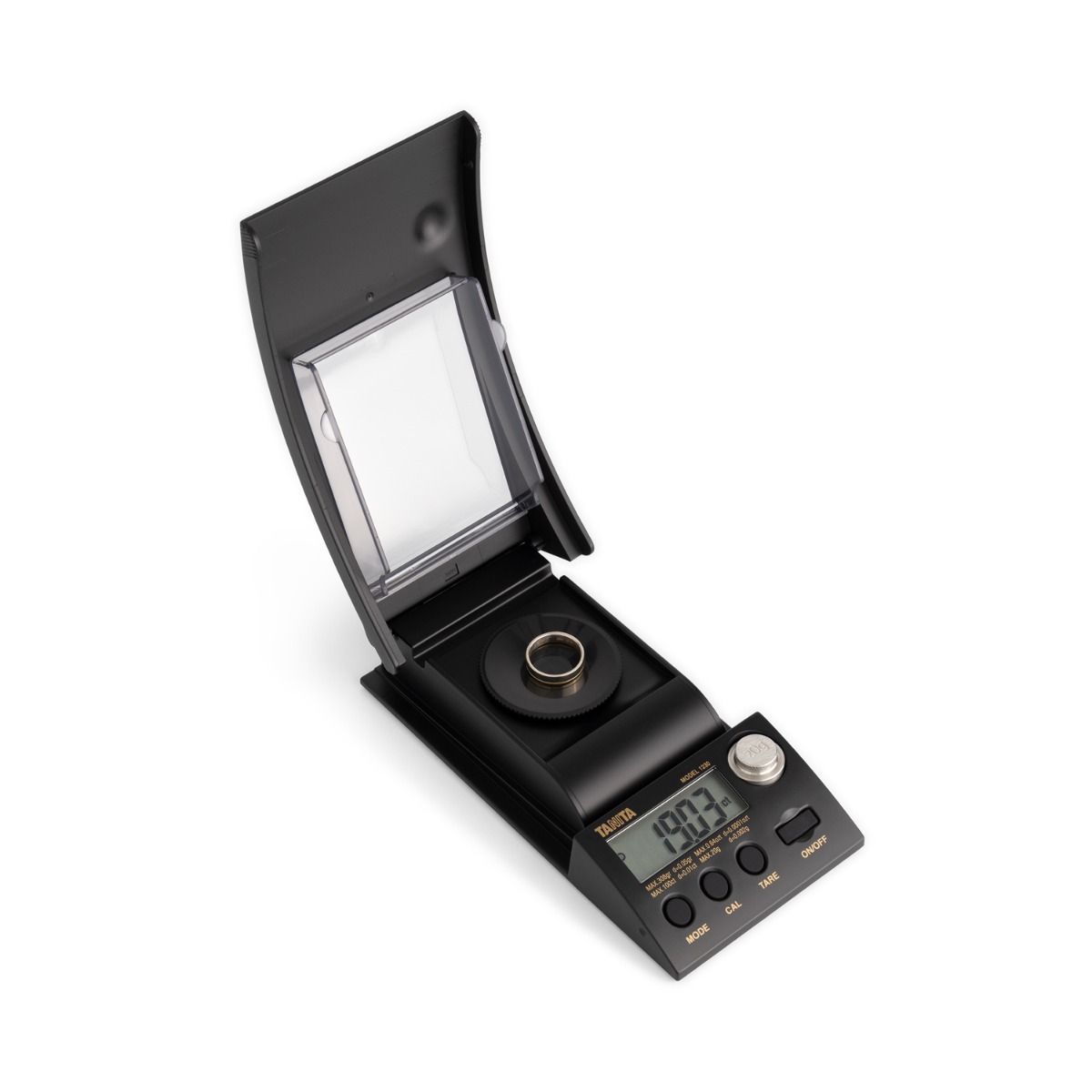 Portable mini scale with draft-eliminating shield