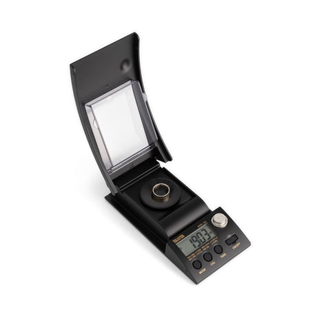 Portable mini scale with draft-eliminating shield